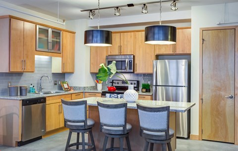 Kitchen with dinning table at Arcade Apartments, Missouri